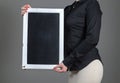 Waitress holding chalkboard vertically Royalty Free Stock Photo