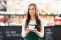 Waitress holding cup of coffee