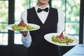 Waitress holding plates Royalty Free Stock Photo