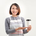 A waitress holding and serving a paper cup of hot coffee in cafe Royalty Free Stock Photo