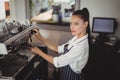 Waitress preparing espresso at restaurant