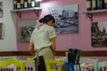 waitress in a restaurant tidying up a table