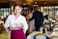 Waitress satisfied with good tip from guests