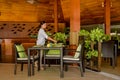 Waitress serves the table in the restaurant