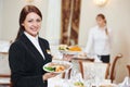 Waitress serving banquet table