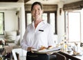 Waitress serving breakfast at a restaurant Royalty Free Stock Photo