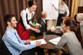 Waitress serving business people conference room Royalty Free Stock Photo