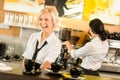 Waitress serving coffee cups making espresso woman Royalty Free Stock Photo