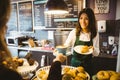 Waitress serving a cup of coffee Royalty Free Stock Photo