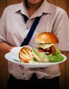 Fresh tasty large cheese BLT burger with french fries on white p Royalty Free Stock Photo