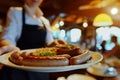 waitress serving a plate of bratwurst