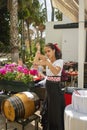 Waitress serving and pouring Sherry, a traditional habit called Venenciar in Malaga, Spain