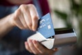 Waitress swiping credit card on pos Royalty Free Stock Photo