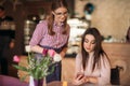 Waitress taking order from her customer in a cafe Royalty Free Stock Photo