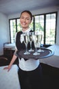 Waitress with a tray of flute of champagne