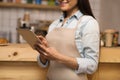 Waitress using digital tablet Royalty Free Stock Photo