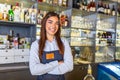 Waitress wearing apron smilling looking at camera. Happy businesswoman. Small business owner of girl entrepreneur. Cafe employee Royalty Free Stock Photo