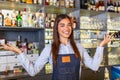 Waitress wearing apron smilling looking at camera. Happy businesswoman. Small business owner of girl entrepreneur. Cafe employee Royalty Free Stock Photo