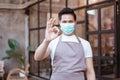 Waitress wearing a face mask at the coffee shop