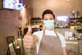 Waitress wearing a face mask at the coffee shop