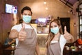 Waitress wearing a face mask at the coffee shop