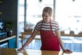 Waitress wiping table at counter Royalty Free Stock Photo