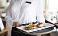 Waitress working in a hotel restaurant Royalty Free Stock Photo