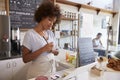 Waitress writing down an order at a coffee shop, close up Royalty Free Stock Photo