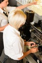 Waitresses at work make coffee machine cafe Royalty Free Stock Photo