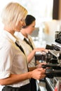 Waitresses at work make coffee machine cafe Royalty Free Stock Photo