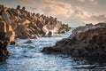 Tetrapods structures on the beach during sunset or dusk as protection for big waves in Wakamatsu, Fukuoka, Japan. Royalty Free Stock Photo