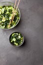 Wakame salad raw seaweed with cucumber slices and sesame in bowl on dark gray background Royalty Free Stock Photo