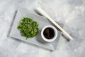 Wakame seaweed salad with sesame seeds and chili pepper in a bowl on concrete background Royalty Free Stock Photo