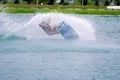 Wake board rider sliding trick with water splash Royalty Free Stock Photo