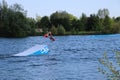 Wake-boarder back flip jump at Cergy water amusement park, France Royalty Free Stock Photo