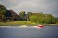 Wake-boarding on a lake behind a boat