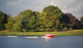 Wake-boarding on a lake behind a boat