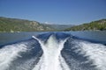 Wake from boat on Lake McCall, Idaho and Pine Trees in summer Royalty Free Stock Photo