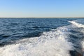 wake of the boat on the surface of the sea on a summer day Royalty Free Stock Photo