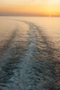 Following the sea - ship wake at sunset Royalty Free Stock Photo