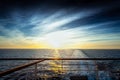 Wake left on the sea by a cruise ship at sunset Royalty Free Stock Photo