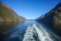 Wake of the ship while scenic cruising down Geiranger fjord. Beautiful landscape with mountains, Norway. Royalty Free Stock Photo