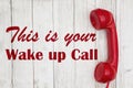 Wake up call text with retro red phone handset Royalty Free Stock Photo