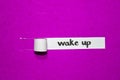 Wake up text, Inspiration, Motivation and business concept on purple torn paper