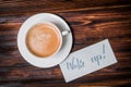 Wake up text near cup of coffee. Font of lettering word on white paper by calligrapher. Morning, handwriting, lettering, concept