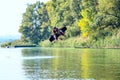 Wakeboarder is flying behind the cable Royalty Free Stock Photo