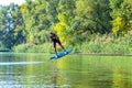 Wakeboarder is flying behind the cable Royalty Free Stock Photo