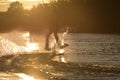 Wakeboarder making tricks. Low angle shot of man wakeboarding on a lake. Royalty Free Stock Photo