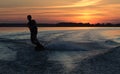 Wakeboarder making tricks on sunset