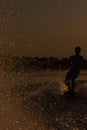 Wakeboarder making tricks on sunset